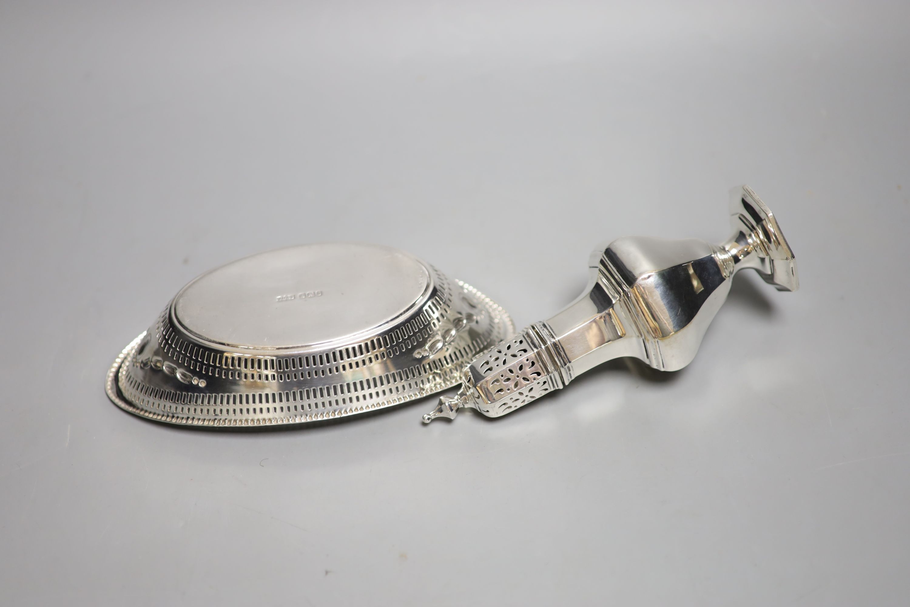 A late Victorian pierced silver oval dish, Sheffield, 1896, 18.7cm and a later silver sugar caster, 6.5oz.